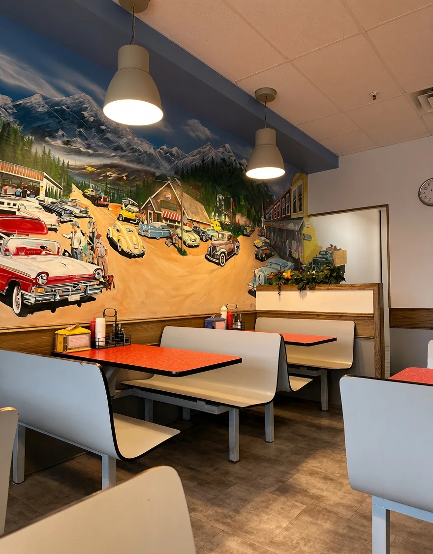 Diner-style dining room with a classic car mural at Golden Fish & Chips on Upper Gage Ave, Hamilton